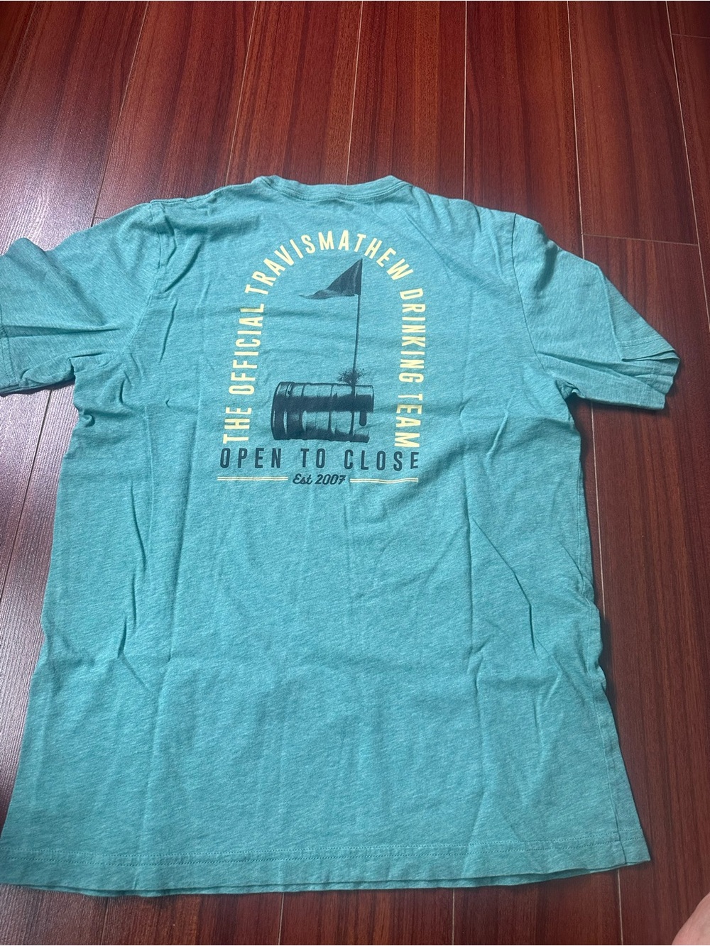 Travis Mathew Teal Short-Sleeve Graphic Tee with Yellow Print